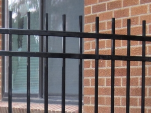 This extended picket fence style is available during our ornamental Iron Fencing sale