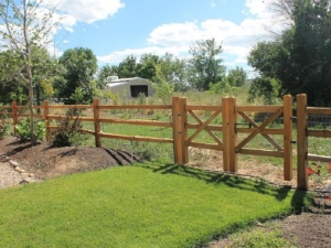 A split rail fence with a gate